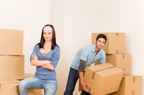 Professional movers handling furniture in a Twickenham home