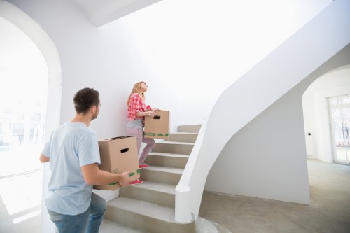 Unpacking boxes in a Twickenham apartment after relocation